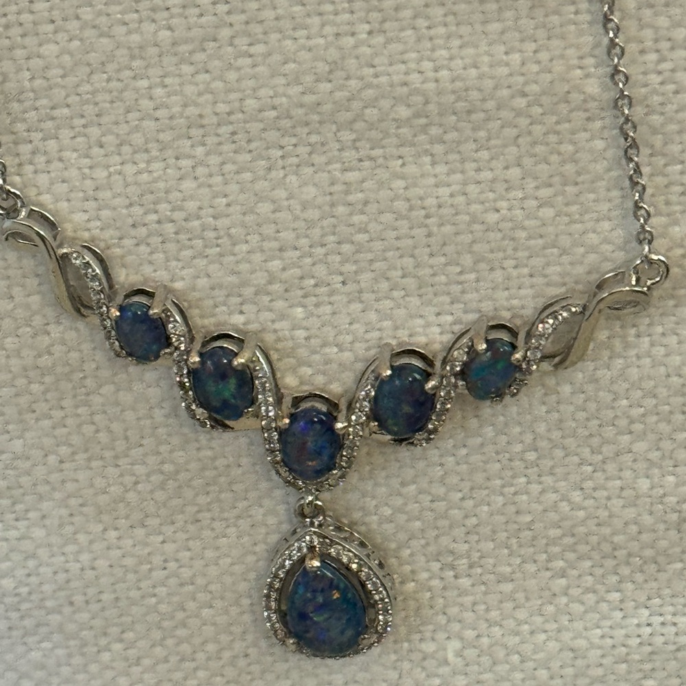 D'Joy sterling silver pendant necklace featuring opals.worn once. Adjustable.